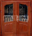 Металлические двери в коттедж из массива дерева